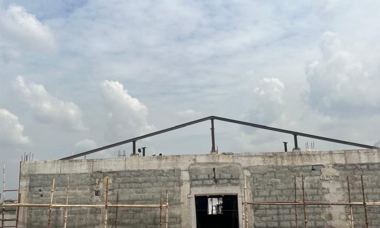 Customer service building; Metal Roof Frames being fabricated and installed for roof structure